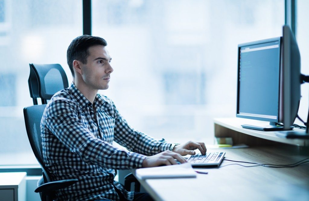guy sitting in front of computer