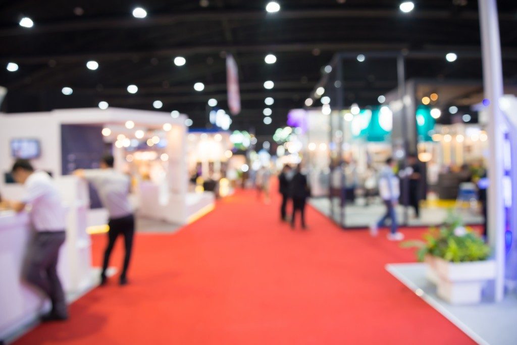 Abstract blur people in exhibition hall event trade show background