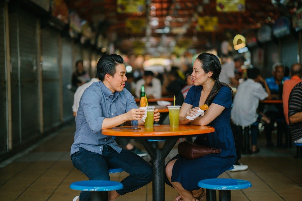 couple dining at an open area