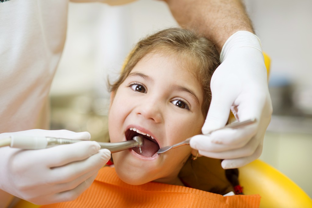 child having teeth checked