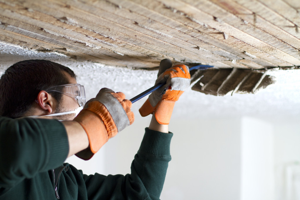 man repairing the ceiling