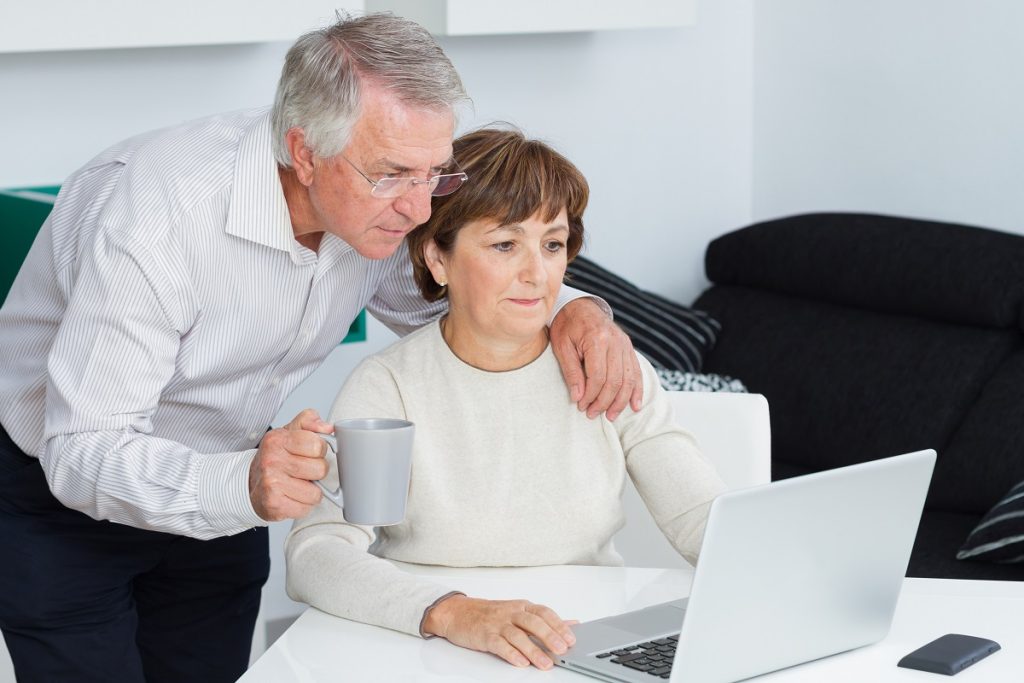 older couple looking at the laptop