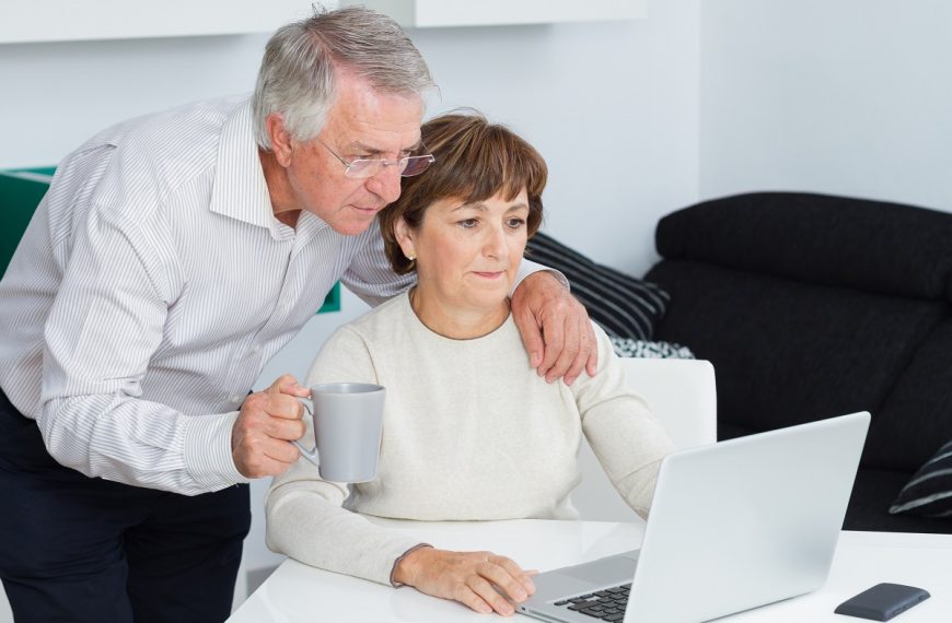 older couple looking at the laptop