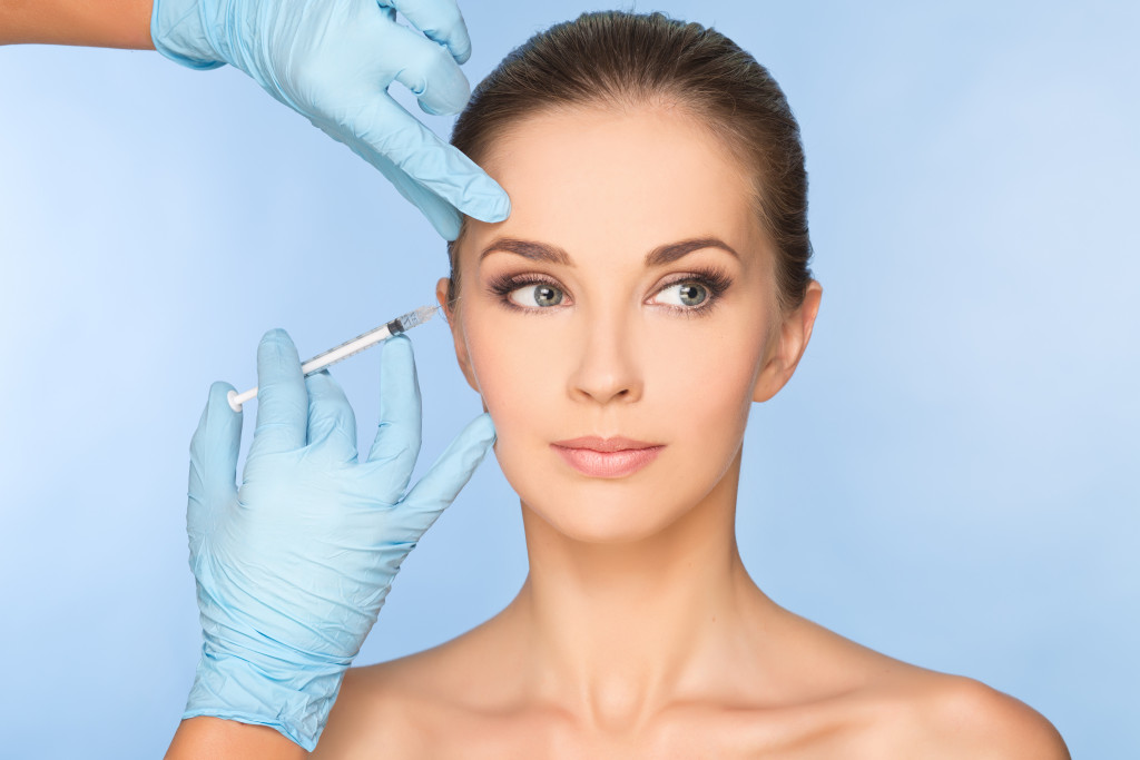 a woman getting a skincare treatment from a professional