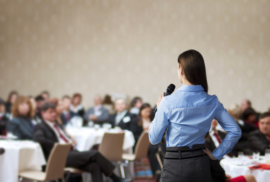 A woman talking at a seminar