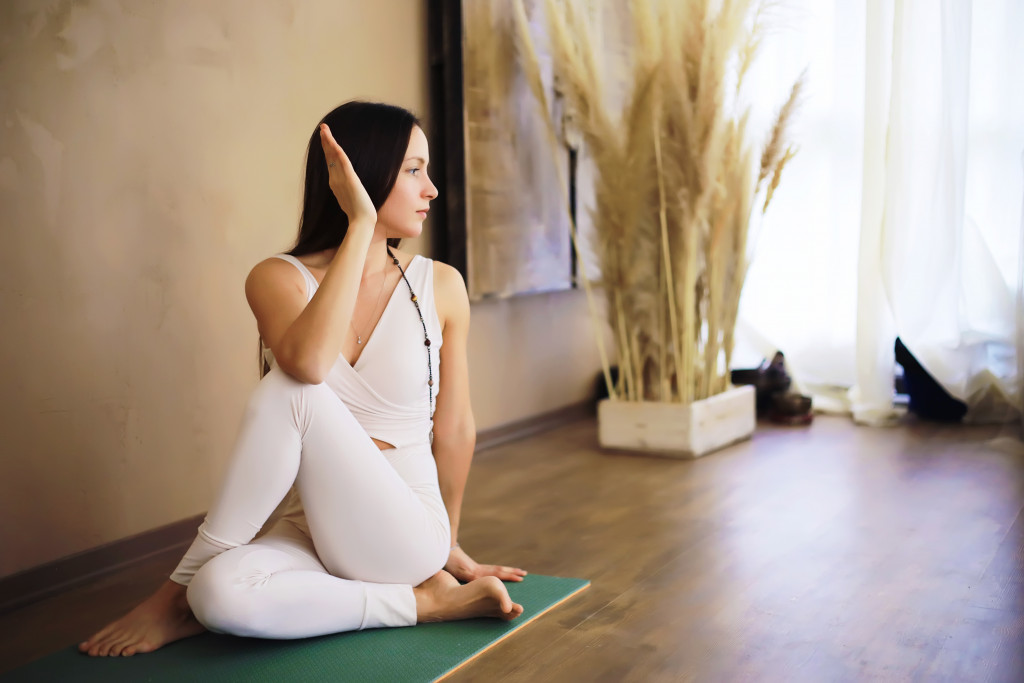 woman doing yoga at home